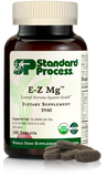 Image of E-Z Mg bottle next to tablets of magnesium supplements.