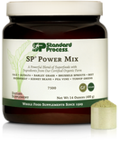 Tub of SP Power Mix next to a scoop of the green powder.